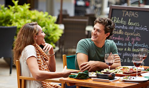Couple laughing together at restaurant