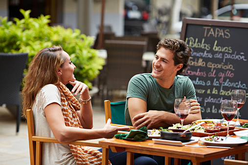 Couple laughing together at restaurant